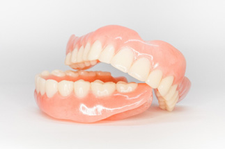 Full set of dentures with white background