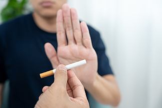 Break bad habits like smoking to protect your dental implants