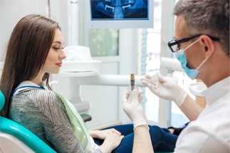An aging gentleman admiring his new dental implant