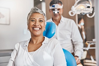 Closeup of patient smiling in treatment chair